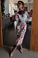 Thumbnail for Geometric Gaia Dress in a multi-colour abstract print and pleated plisse fabric, styled with brown boots.