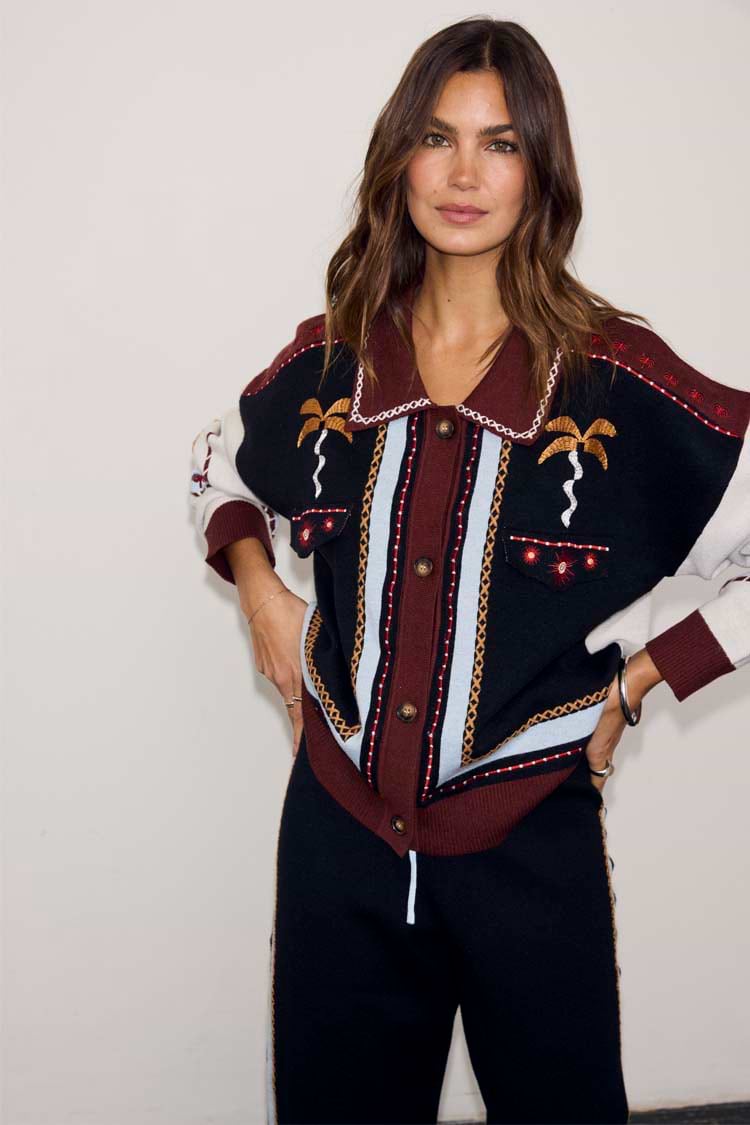 Geometric Knit Cardigan featuring the iconic palm motif, blanket stitch trim and button front in warm autumnal tones.