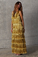 Thumbnail for Gold Fringe Dress with tiered gold foil tassels and a sleeveless neckline on a model.