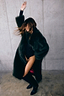 Green Faux Fur Coat in a relaxed silhouette, styled over a black bodysuit for a statement look.