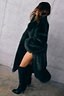 Thumbnail for Green Faux Fur Coat in a relaxed longline silhouette, styled with tall black boots for feel good dressing.