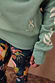 Sage Sundazed Accessible Sweatshirt with cream palm print, embroidered logo, and thumb hole detail.