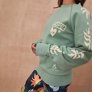 Sage green Sundazed sweatshirt with cream palm prints and a functional zip for medical treatment access.