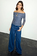 NFD Charcoal Diaz Top in grey mesh with off-the-shoulder ruching, paired with blue wide-leg jeans.
