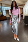 Gunmetal Vegan Leather Jaspre wrap skirt styled with a lilac top and metallic silver heels.
