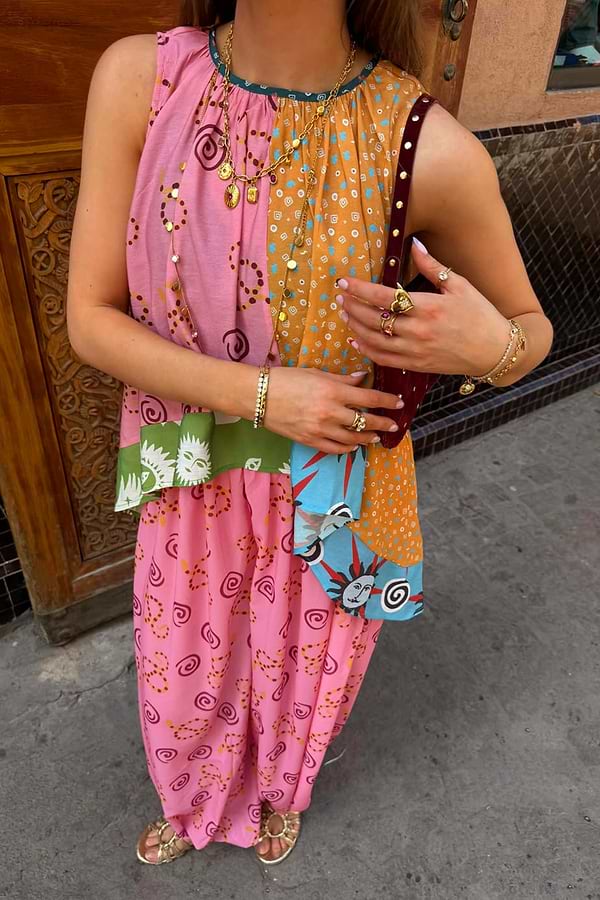 Etta Hankerchief Hem Top with multi-colour panels and iconic sun prints, styled with matching pink balloon trousers.
