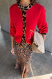 Red Cherry Holly Cardigan with leopard print trim and cherry motifs, styled with a leopard print skirt and suede bag.