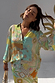 Isla Miley Shirt featuring a multi-coloured hand-painted sun and map print in an oversized button-up style.