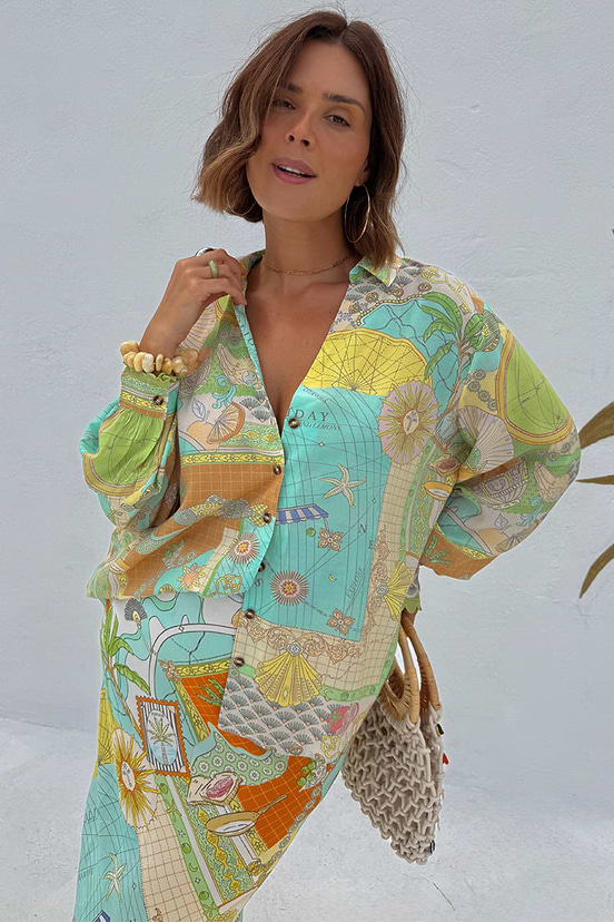 Isla Miley Shirt featuring a hand-painted Isla print with sun motifs and an oversized, button-up silhouette.