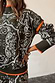 Thumbnail for Khaki Bandana Dana Jumper with white bandana print, roll neck, and contrast orange trim on the cuffs and hem.