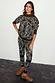 Khaki Bandana Dana Jumper with roll neck and orange trim, styled as a co-ord with matching joggers and leopard trainers.