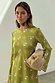 Khaki Eye Mini Soho Dress Petite with the iconic green eye print, flared sleeves, a neck scarf and tan clutch bag.