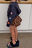 Thumbnail for Kids Navy Charms Sweatshirt with colourful sun motifs on the sleeves, styled with leopard print shorts.