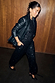 Thumbnail for Black Leather Blazer with a relaxed silhouette and shoulder pads, layered over a black sequin jumpsuit.