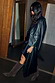 Black Leather Blazer in a relaxed silhouette with shoulder pads, styled as a transeasonal investment piece.