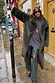 Bottle Green Studded Vegan Leather Trousers with side stud details, styled with a faux fur coat for a London street style.