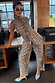 Leopard Barrel Jeans Petite in a relaxed silhouette styled with a matching waistcoat and blue heels.