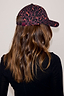 Thumbnail for Dark Leopard Cap in iconic burgundy leopard print with adjustable back strap, shown on a model.