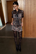 Cherry Leopard Mini Lyla Dress featuring black lace detailing and tie-neck, paired with lace tights.