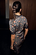 Cherry Leopard Mini Lyla Dress with black lace trim and cherry details, back view.