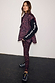Dark Leopard Gilet with a padded funnel neck, styled with matching leggings and a black long-sleeve top.