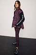 Dark Leopard Gilet with a padded funnel neck, styled with matching leggings and a black long-sleeve top.