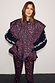 Dark Leopard Gilet with a funnel neck and padded finish, styled over matching leopard print leggings.
