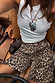 Thumbnail for Leopard Lucia Scallop Pocket Long Shorts styled with a white ribbed vest top and necklaces.