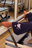 Thumbnail for Orange cotton NFD socks worn on a Pilates reformer, ideal for gym sessions and activewear styles.