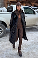 Leopard print thermal leggings and matching top styled with a dark coat in a snowy setting.