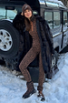 Leopard Thermal Leggings and matching base layer top, styled with a faux fur coat in a snowy setting.