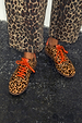 Leopard Pony Trainer in premium leather with leopard print, orange laces and matching trousers.
