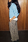 Lucia Leopard Elissa Trousers with a wide-leg fit and side pockets, paired with a blue cardigan and white shirt.