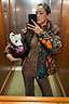 Thumbnail for Leopard Ski Trousers with a high waist and orange side stripes, styled with a matching leopard top and ski gear.