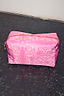 Thumbnail for Vibrant pink bandana print make up bag with a white paisley pattern and gold-tone zip closure.