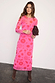 Pink and red Morocco Mesh Dress with iconic hand and heart motifs, styled with brown suede boots and a clutch.