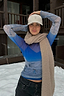 Blue Ski Slopes Mesh Long Sleeve Top with mountain print, styled with a beige scarf in a snowy setting.