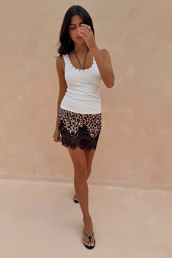 White Studded Rib Vest with gold neckline detail, paired with a leopard print and black lace mini skirt.