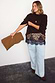 Leopard Lace Mini Maeva Skirt with black lace trim, layered over light wash wide leg jeans and a brown jumper.