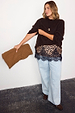 Leopard Lace Mini Maeva Skirt with black lace trim, layered over light wash wide leg jeans and a brown jumper.