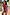 Thumbnail for Blue and Red Holly Cardigan with sun and eye motifs and tortoise shell buttons, paired with a tan suede mini skirt.