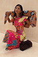 Morocco Remi midi dress in a colourful patchwork sun print with frilled sleeves and tortoise button detailing.