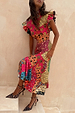 Morocco Remi Dress in a vibrant abstract patchwork print with pleated frill sleeves and an asymmetrical skirt.