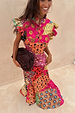 Multi-coloured Morocco Remi Dress featuring an abstract patchwork print, pleated frill sleeves and tortoise buttons.