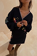 Black Night Garden Mini Wrap Skirt with pink blanket stitch and celestial motifs, styled as a knit co-ord.