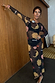 Thumbnail for Black Mystical Mesh Dress featuring celestial sun and moon motifs in a sheer long-sleeved midaxi style.