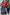 Thumbnail for Red Mystical Knit Bandana with white embroidered motifs, tied around the neck and styled with a pinstripe suit on a London street.