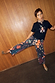 Thumbnail for Black Night Garden Barrel Jeans featuring a mystical leopard and poppy print, styled with leopard heels.