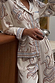 Cream Octopus Button Through Pyjamas featuring a blue sea print, relaxed fit, and contrast piping on the cuffs.