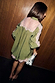 Olive and Pink Lace Marley Shirt with lace panels on the back and sleeves, styled with a monochrome clutch bag.
